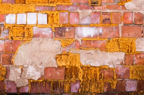 Multicolored peeling wall texture and background. Painted brickwork. Stock Photos