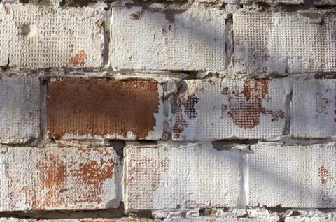 Multicolored peeling wall texture and background. Painted brickwork. Stock Photos