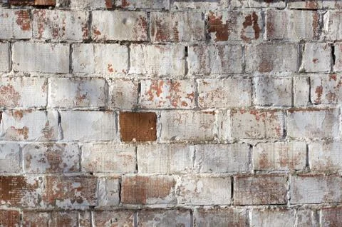 Multicolored peeling wall texture and background. Painted brickwork. Stock Photos