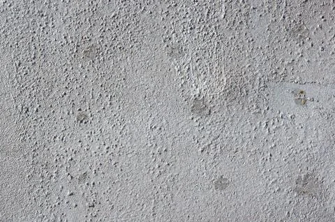 Multicolored peeling wall texture and background. Surface with pimples, sta.. Stock Photos