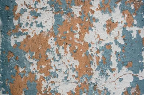 Multicolored peeling wall texture and background. Surface with scratches, sta Stock Photos