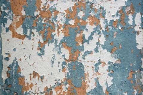 Multicolored peeling wall texture and background. Surface with scratches, sta Stock Photos