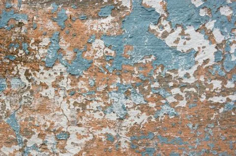 Multicolored peeling wall texture and background. Surface with scratches, sta Stock Photos