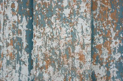 Multicolored peeling wall texture and background. Surface with scratches, sta Stock Photos