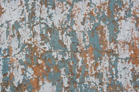 Multicolored peeling wall texture and background. Surface with scratches, sta Stock Photos