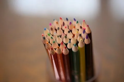 Multicolored pencils on the table. A stack of colored pencils ti Stock Photos