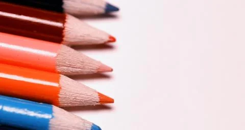 Multicolored pencils on the table. A stack of colored pencils ti Stock Photos