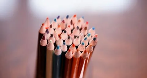 Multicolored pencils on the table. A stack of colored pencils ti Stock Photos
