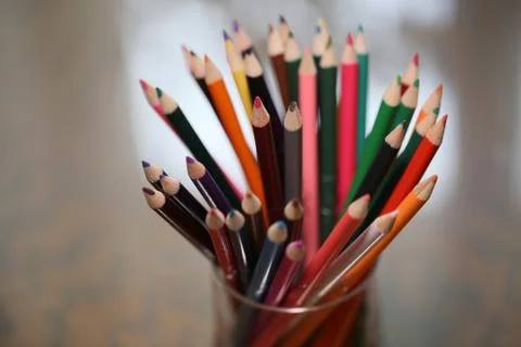 Multicolored pencils on the table. A stack of colored pencils ti Stock Photos