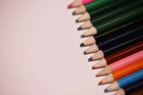 Multicolored pencils on the table. A stack of colored pencils ti Stock Photos
