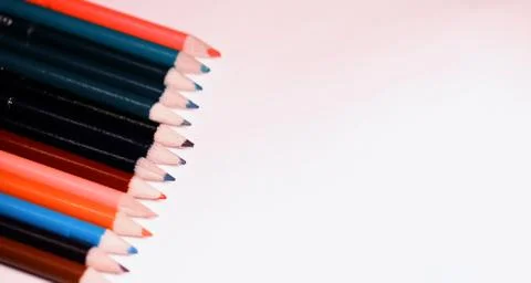Multicolored pencils on the table. A stack of colored pencils ti Stock Photos