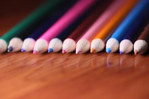 Multicolored pencils on the table. A stack of colored pencils ti Stock Photos