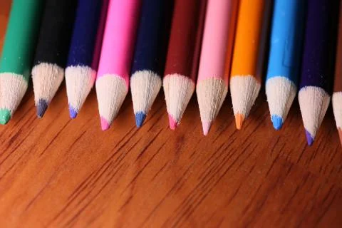 Multicolored pencils on the table. A stack of colored pencils ti Stock Photos