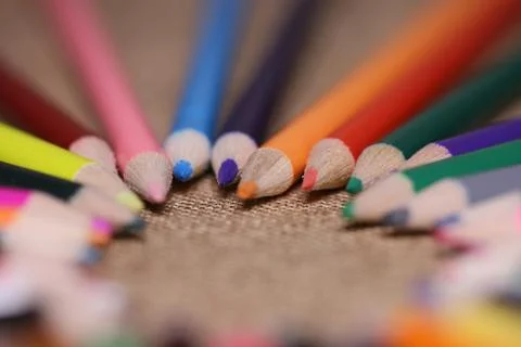 Multicolored pencils on the table. A stack of colored pencils ti Stock Photos