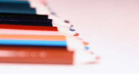 Multicolored pencils on the table. A stack of colored pencils ti Stock Photos