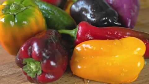 Multicolored Peppers Variety Rotating On Tabletop. Stock Footage 346296844
