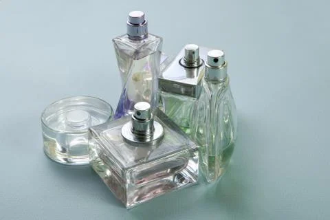 Multicolored perfumes in bottles of different shapes Stock Photos