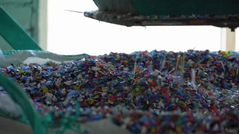 Multicolored PET flakes packed in a big bag. Close up. Stock Footage 128998607