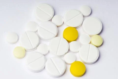 Multicolored pills on white background Stock Photos