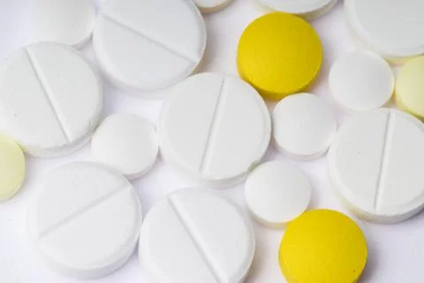 Multicolored pills on white background Stock Photos