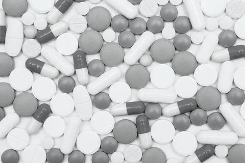 Multicolored pills on white background Stock Photos
