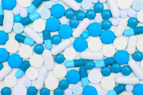 Multicolored pills on white background Stock Photos