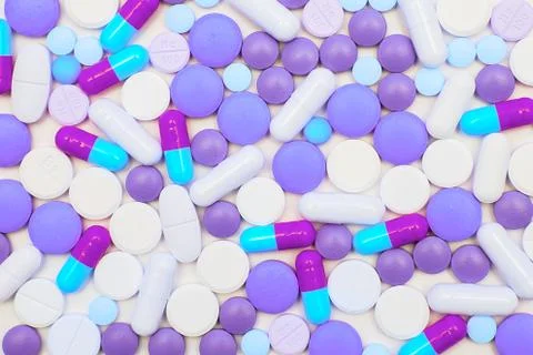 Multicolored pills on white background Stock Photos