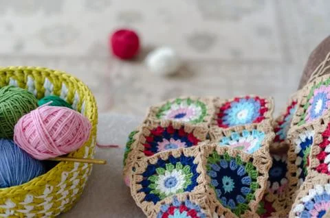 Multicolored plaid squares of crocheted Stock Photos