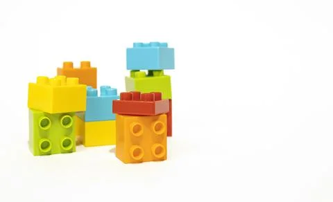 Multicolored plastic building blocks isolated on white background, children's 库存照片