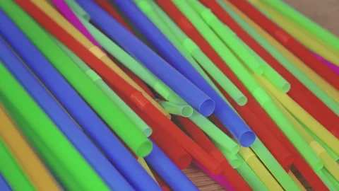 Multicolored plastic cocktail straws move chaotically Stock Footage 306303979