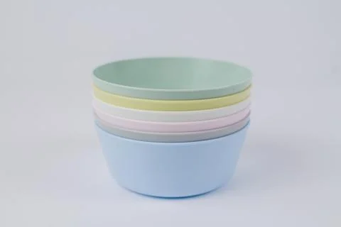 Multicolored plastic plates on a white background Foto stock