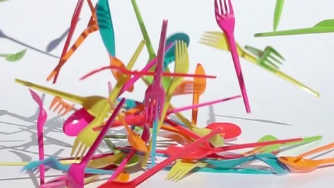 Multicolored plastic spoons, knives and forks Stock Footage 114789976