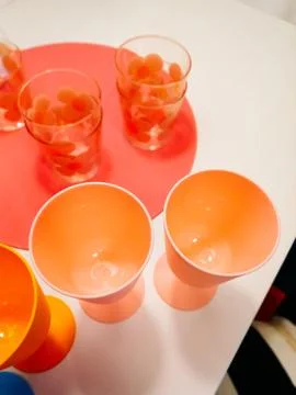 Multicolored plastic tableware. Tableware for a picnic made of colored plasti Stock Photos