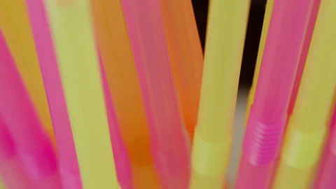 Multicolored plastic tubes cocktail, close-up, camera movement, rack focus Stock Footage 141596802