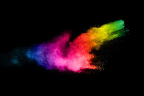 Multicolored powder explosion on black background.Color dust splash cloud o.. Stock Photos