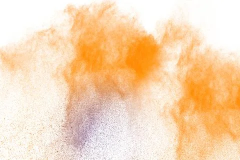 Multicolored powder explosion on white background. Freeze motion paint Holi. Stock Photos