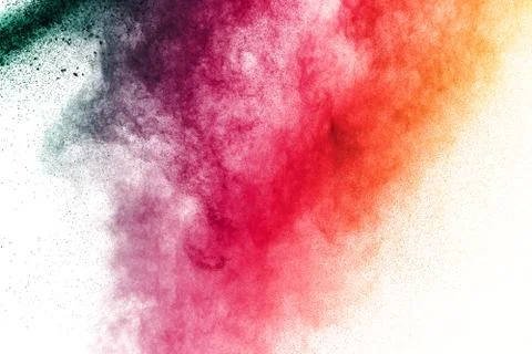 Multicolored powder explosion on white background. Stock Photos