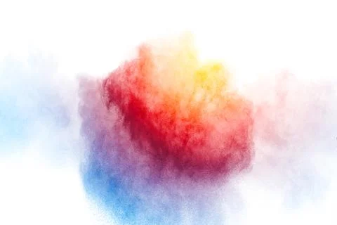 Multicolored powder explosion on white background. Stock Photos