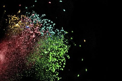 Multicolored powder explosion on white background. Colored cloud. Colorful dust Stock Photos