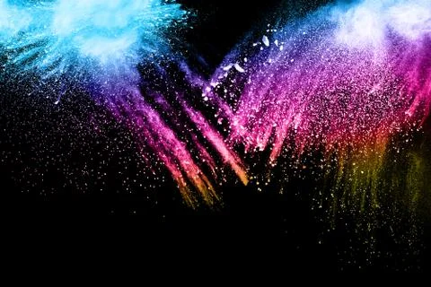 Multicolored powder splash on black background. Stock Photos