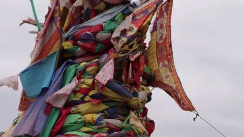 Multicolored Prayer Flags Waving in Wind Over Ovoo Stone Cairn Mongolia Stockbeeldmateriaal 348047096
