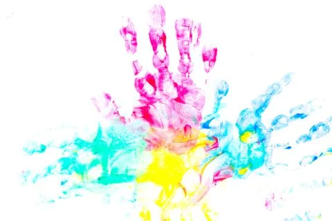 Multicolored prints of children's hands and feet on white background. Abstrac Stock Photos