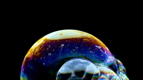 Multicolored rainbow colors of a single soap bubble that looks like a fantasy Stock Footage 114743255