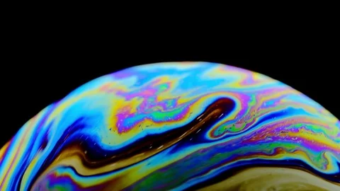 Multicolored rainbow colors of a single soap bubble that looks like a fantasy Stock Footage 114768595