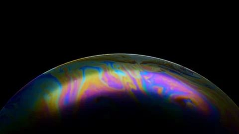 Multicolored rainbow iris soap bubble. Abstract multi-colored surface overflows Stock Footage 125897257
