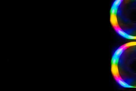 Multicolored rainbow lines on black background Stock Photos