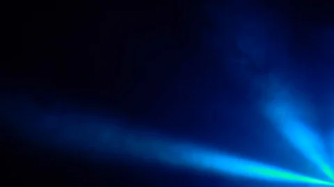 Multicolored rays of light from lanterns in the smoke black background Stock Footage 94018150