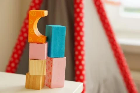 Multicolored rectangular toys for children on top of each other Stock Photos