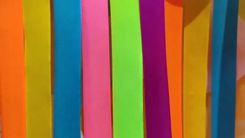 Multicolored red orange yellow blue satin ribbons close up Stock Footage 145731259