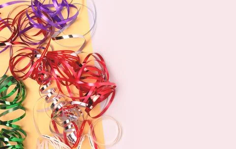 Multicolored ribbons on a gray background. Stock Photos